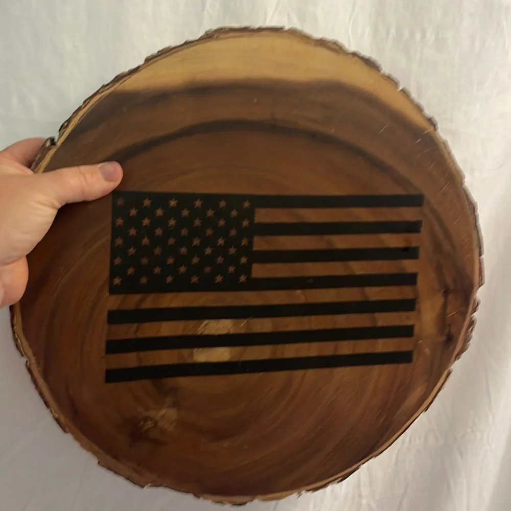 Circle wooden tray trivet with raw edge and black american flag